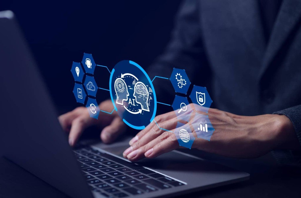 Business professional using a laptop with holographic AI and security icons